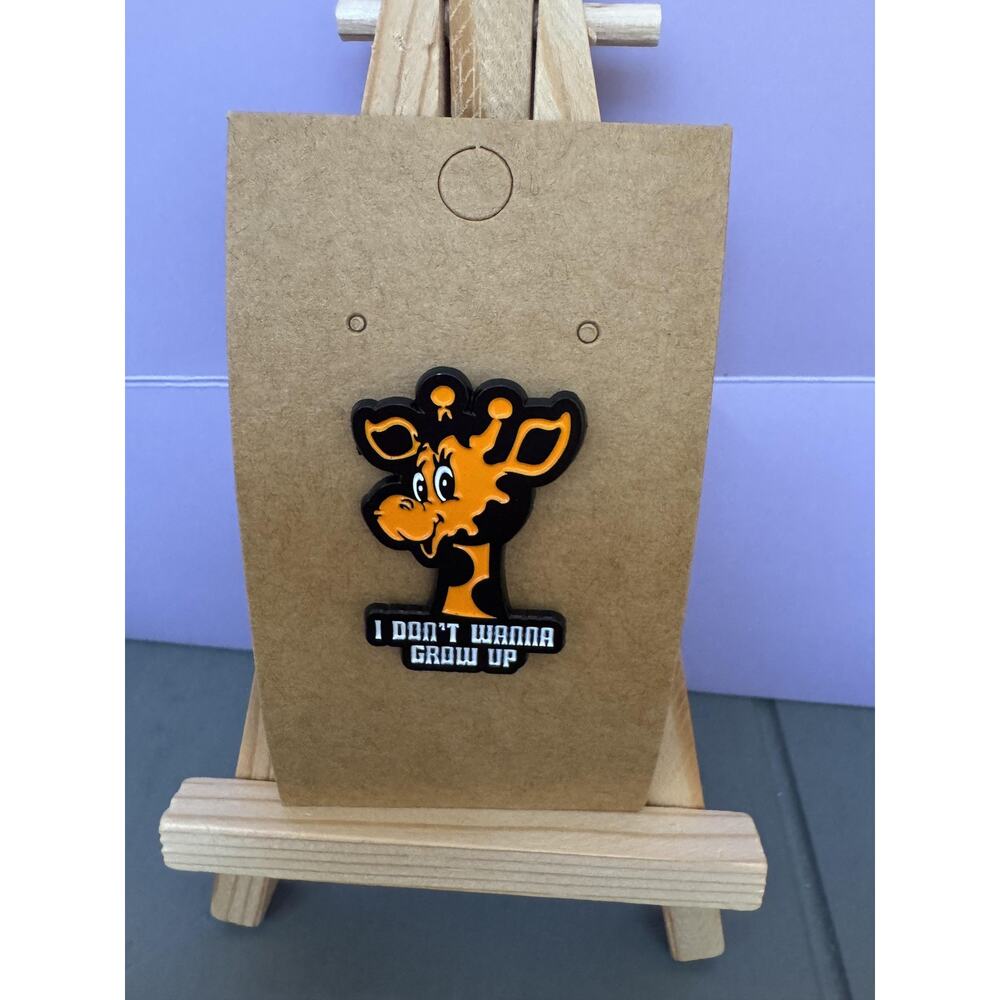 Toys R Us Geoffrey Giraffe I Don't Wanna Grow Up Enamel Lapel Pin Orange Badge